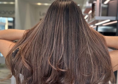 Luxurious brunette hairstyle at Leo & Simon Salon in Windsor, England, GB. Perfectly styled hair for elegance.