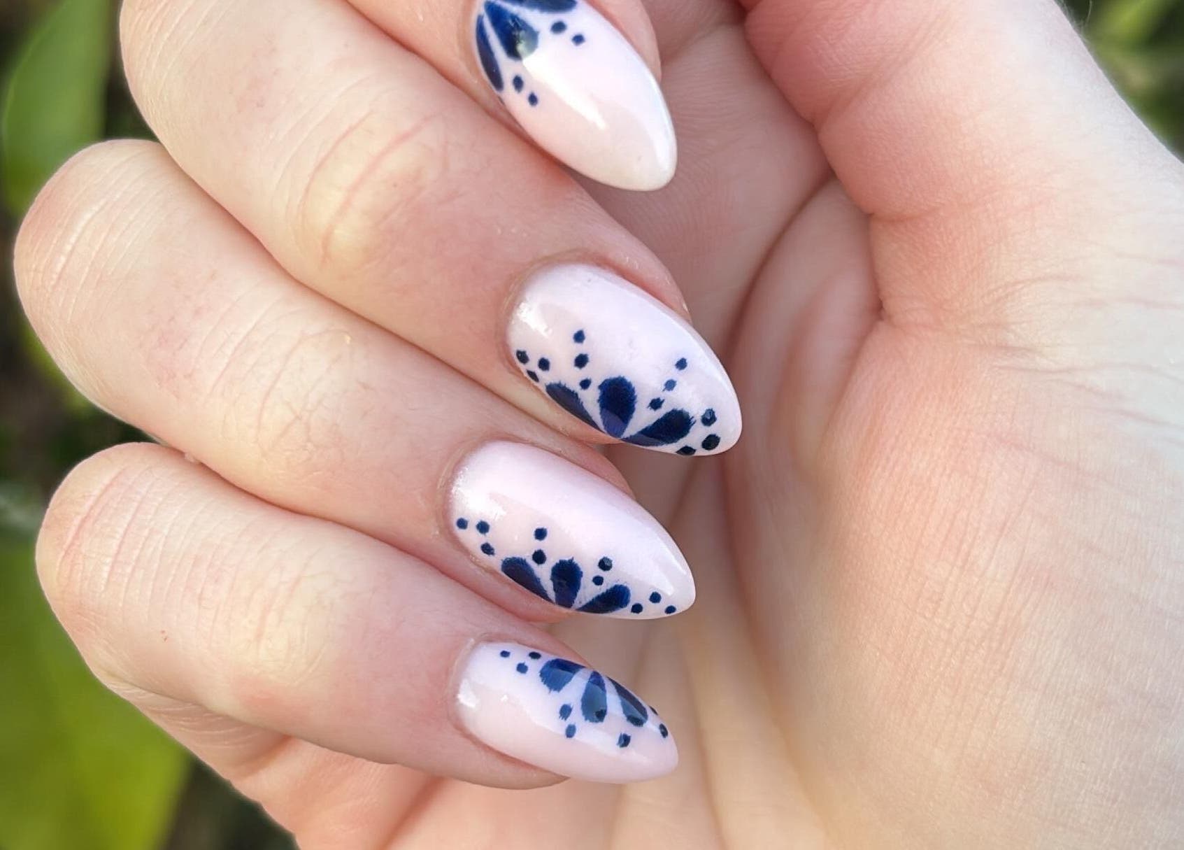 Hand with floral nail art from Cassandra Jade’s Collective, Alberton, Gauteng, ZA.