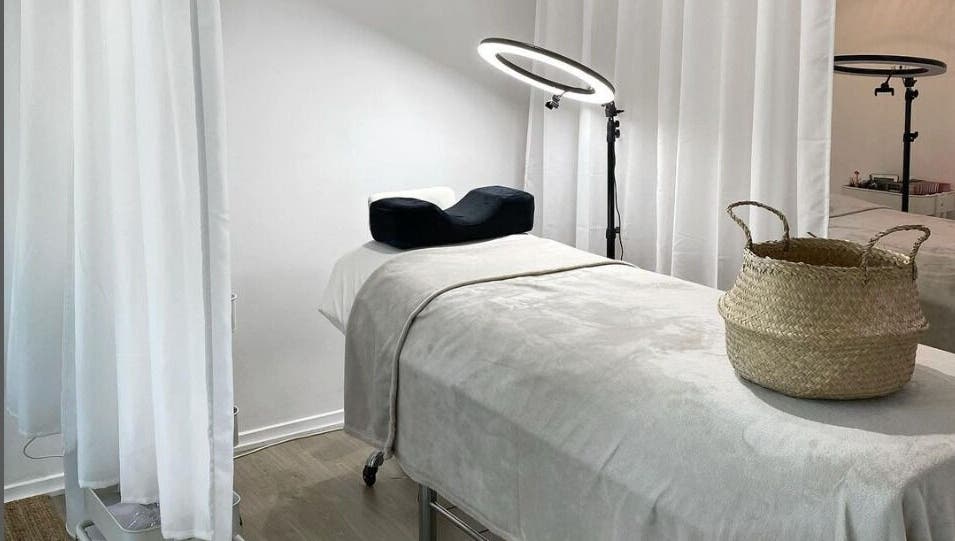 Tranquil treatment room at The Lash Cove, Meridan Plains, Queensland, AU. Cozy decor and modern lighting.