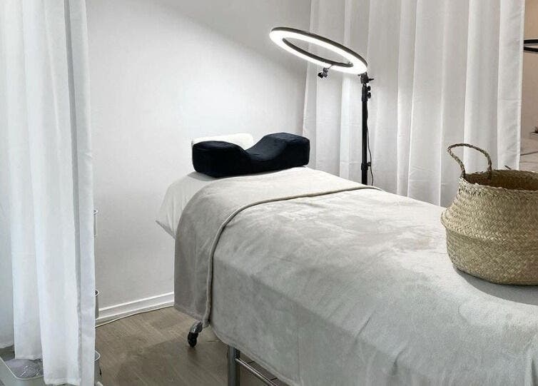 Tranquil treatment room at The Lash Cove, Meridan Plains, Queensland, AU. Cozy decor and modern lighting.