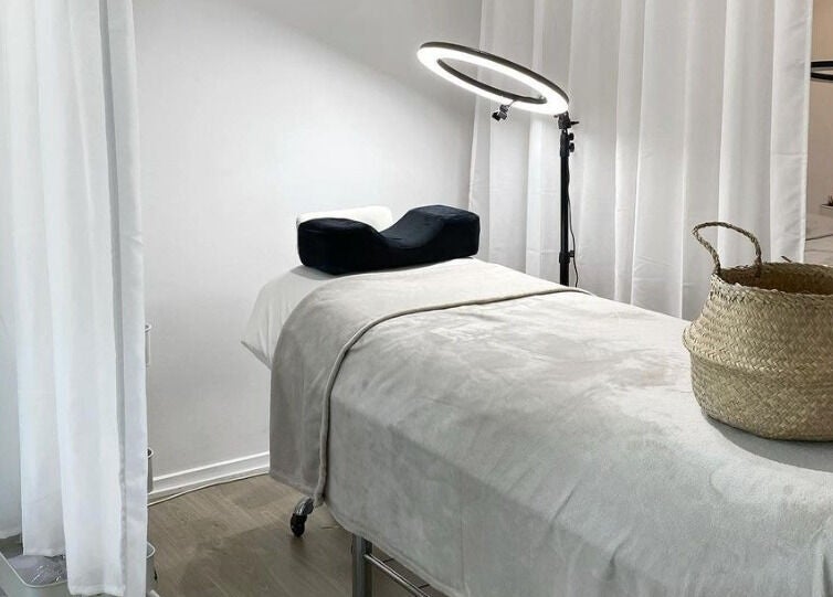 Tranquil treatment room at The Lash Cove, Meridan Plains, Queensland, AU. Cozy decor and modern lighting.