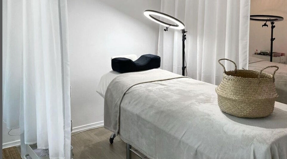 Tranquil treatment room at The Lash Cove, Meridan Plains, Queensland, AU. Cozy decor and modern lighting.