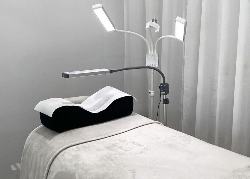 Spa bed at The Lash Cove, Meridan Plains, Queensland, AU, with modern lighting and plush linens.