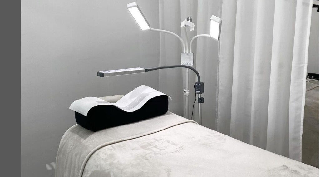 Spa bed at The Lash Cove, Meridan Plains, Queensland, AU, with modern lighting and plush linens.