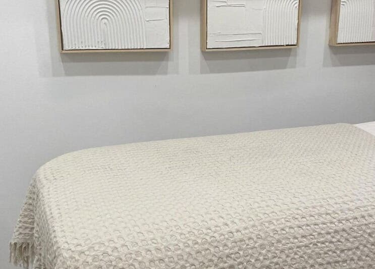 Cozy treatment room at The Lash Cove, Meridan Plains, Queensland, AU showcasing minimalist decor.