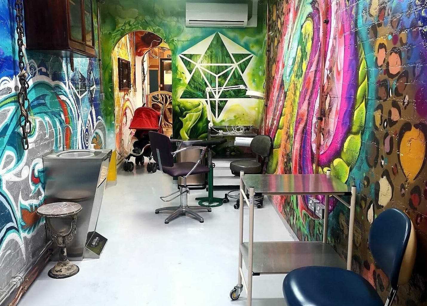 Vibrant mural decor inside Studio Gaia London, enhancing the wellness atmosphere in London, England, GB.