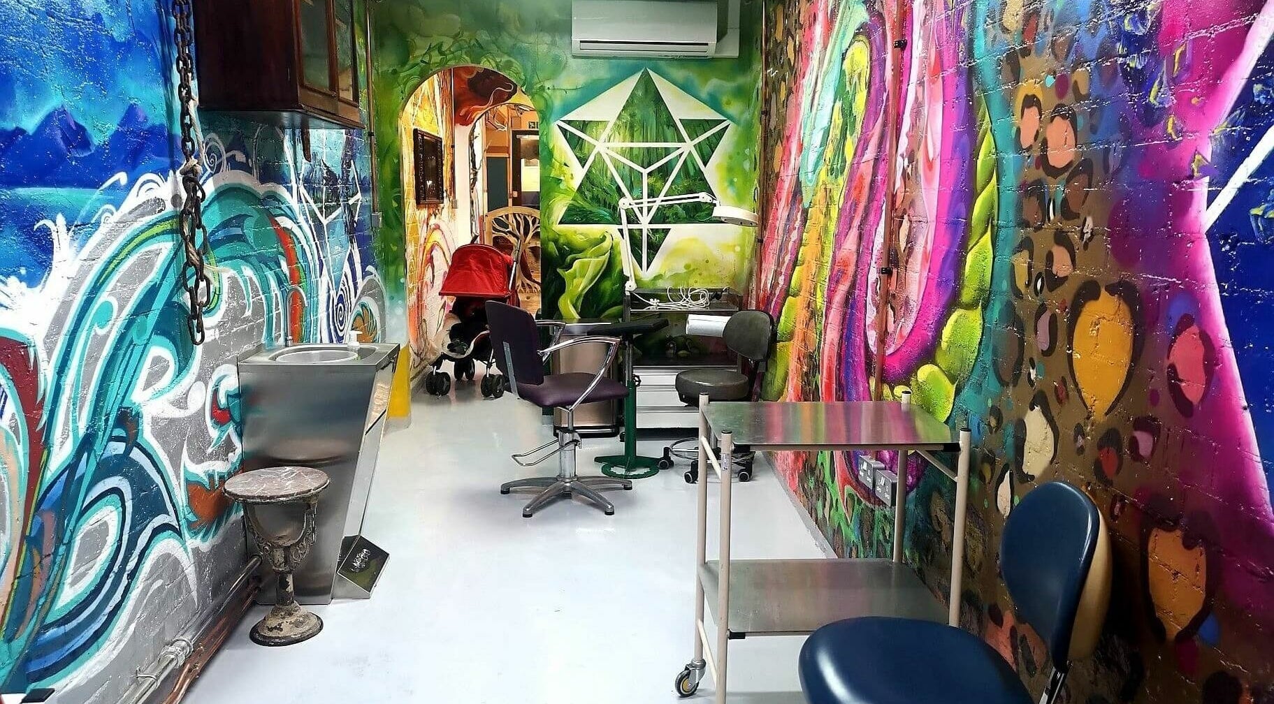 Vibrant mural decor inside Studio Gaia London, enhancing the wellness atmosphere in London, England, GB.