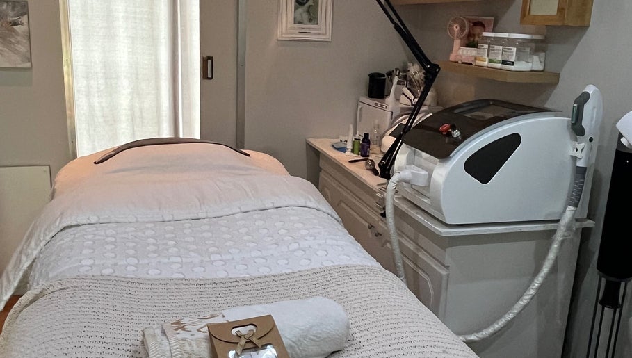 Relaxing treatment room at The Skin Spot in Cape Town, Western Cape, ZA, featuring a cozy bed and equipment.