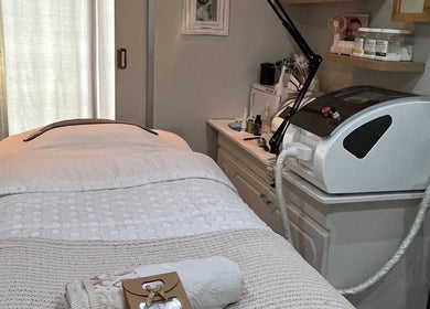 Relaxing treatment room at The Skin Spot in Cape Town, Western Cape, ZA, featuring a cozy bed and equipment.