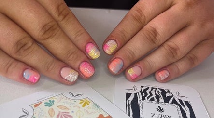 Colorful wave nail art at Kayley Diane Nails, Colchester, England, GB. Perfect manicure showcasing vibrant designs.