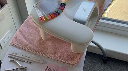 Kayley Diane Nails workstation in Colchester, England, GB showcasing nail colors and tools near a bright window.
