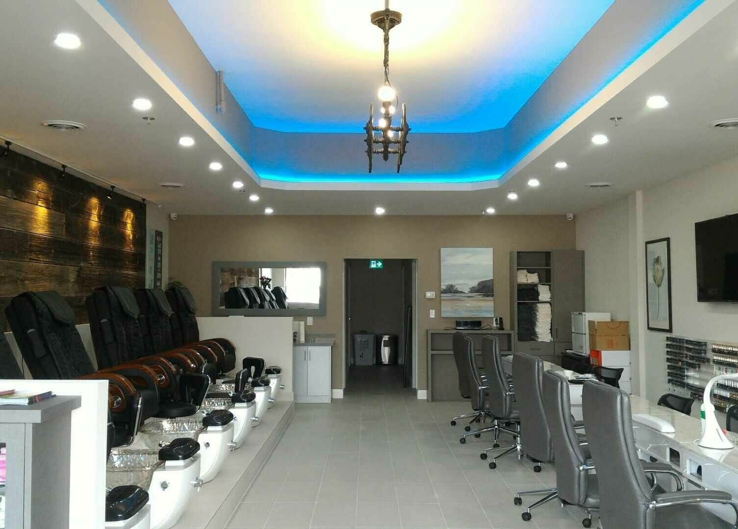 Interior of The Nail Chamber in Markham, Ontario, CA, featuring modern nail stations and elegant decor.