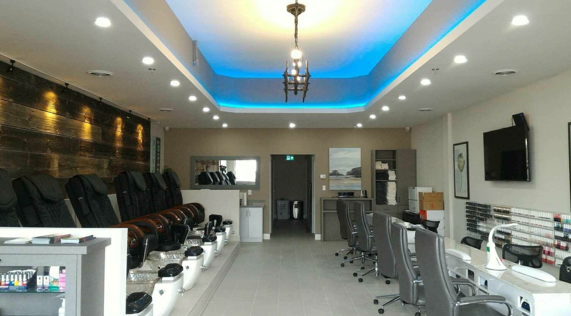 Interior of The Nail Chamber in Markham, Ontario, CA, featuring modern nail stations and elegant decor.