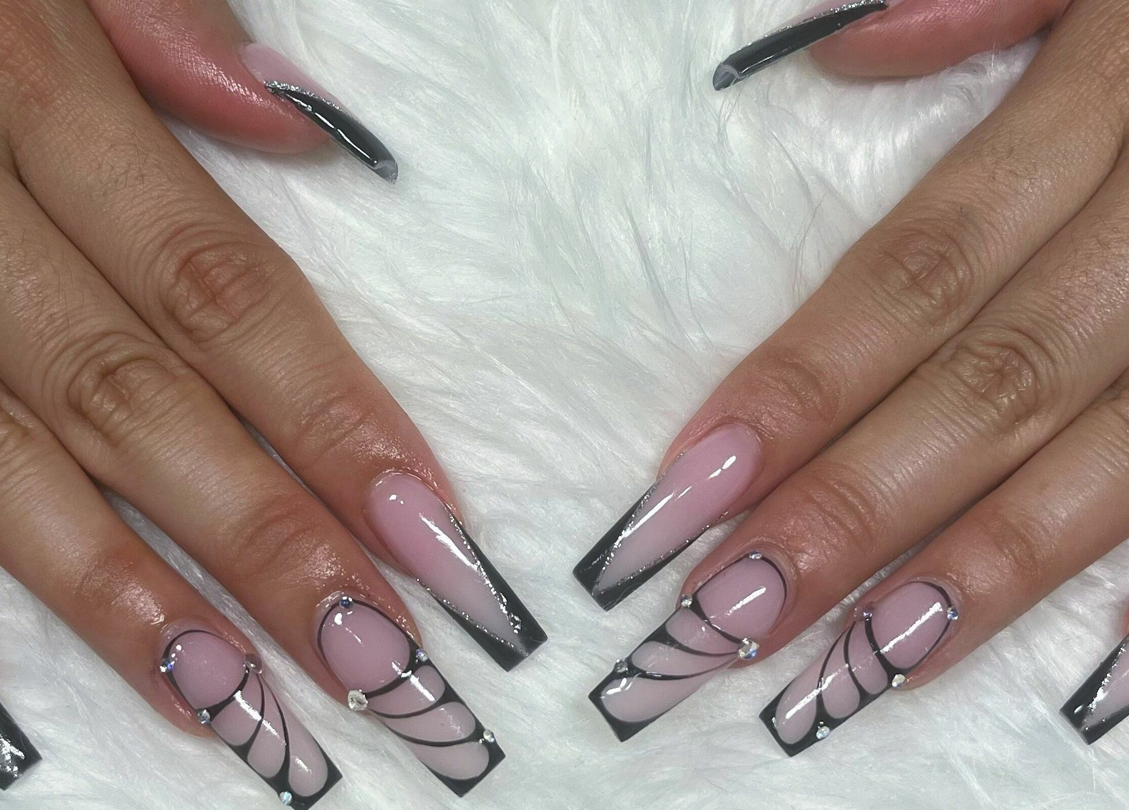 Stylish black and pink nail art at The Nail Chamber, Markham, Ontario, CA, showcasing intricate designs.