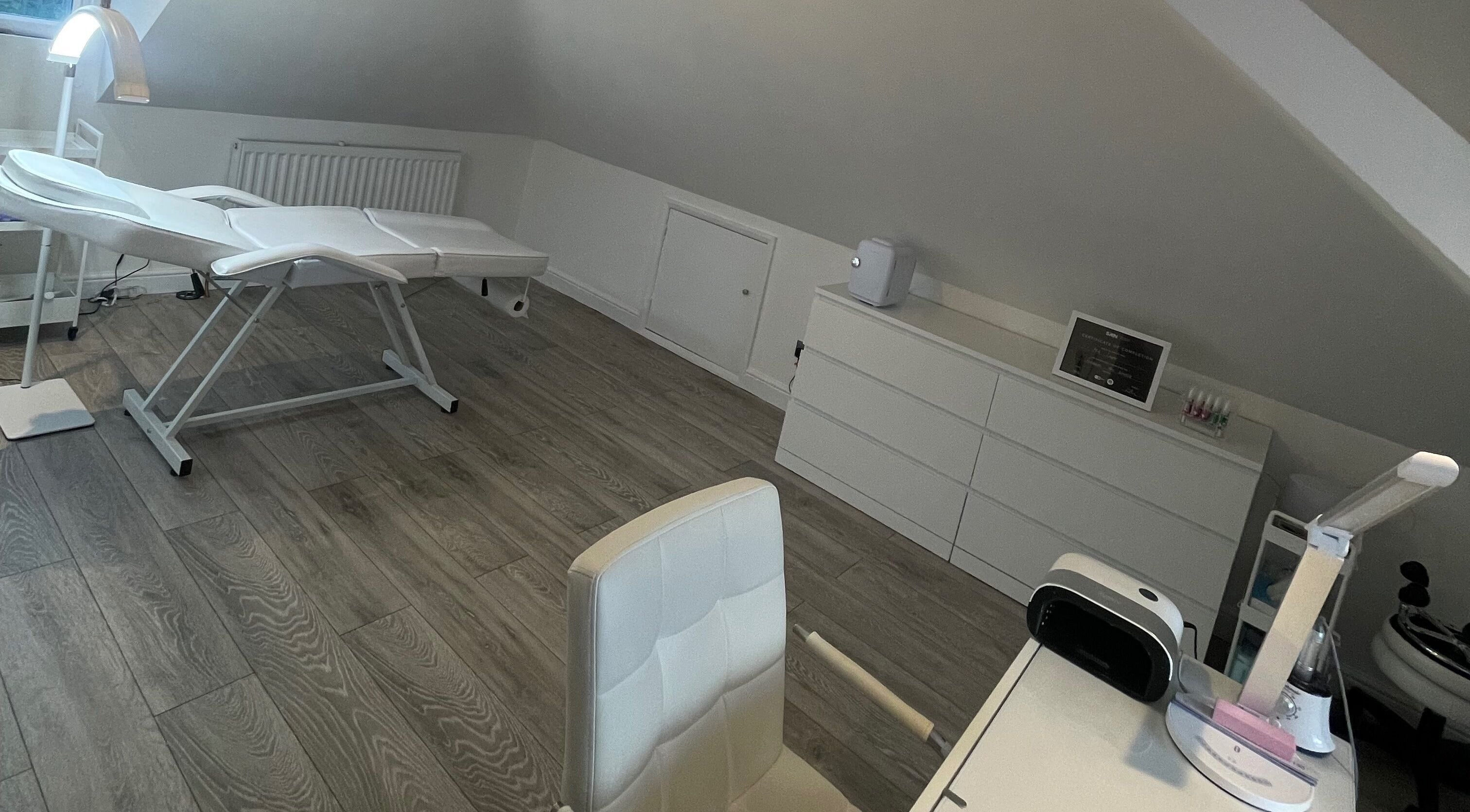 Comfortable spa room at Angel Studio in Fetcham, England, GB with modern treatment bed and sleek furnishings.