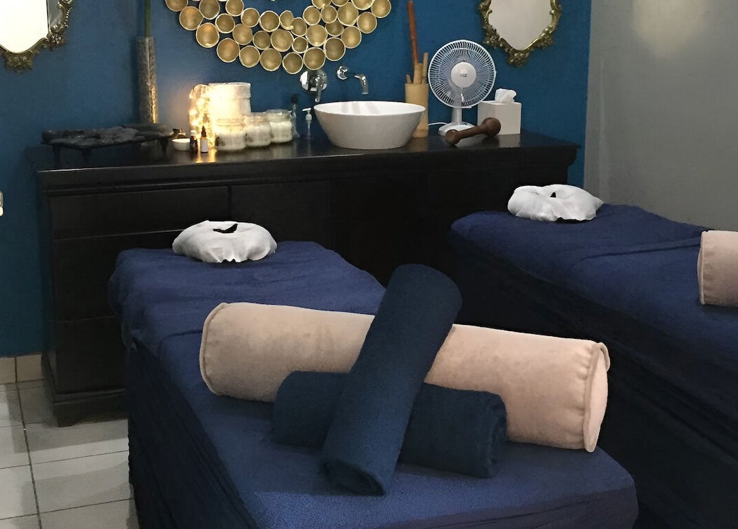 Relaxing massage room at Sodwana Spa, Shazibe, KwaZulu-Natal, ZA with twin beds and calming decor.
