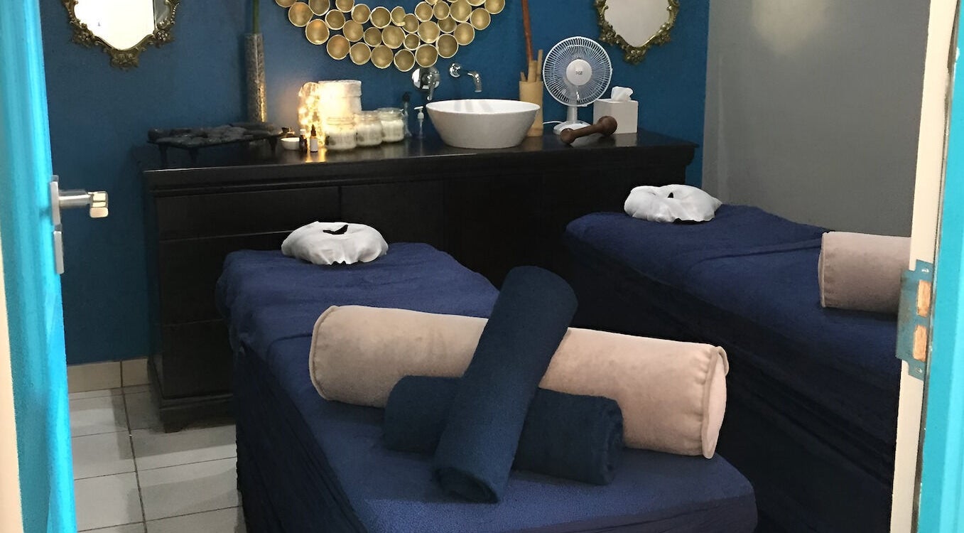 Relaxing massage room at Sodwana Spa, Shazibe, KwaZulu-Natal, ZA with twin beds and calming decor.