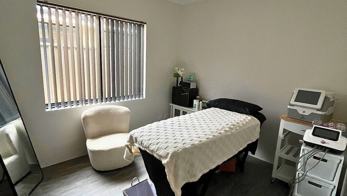 Cozy treatment room at Gods Work Studio, Hilbert, Western Australia, AU with massage bed and seating.
