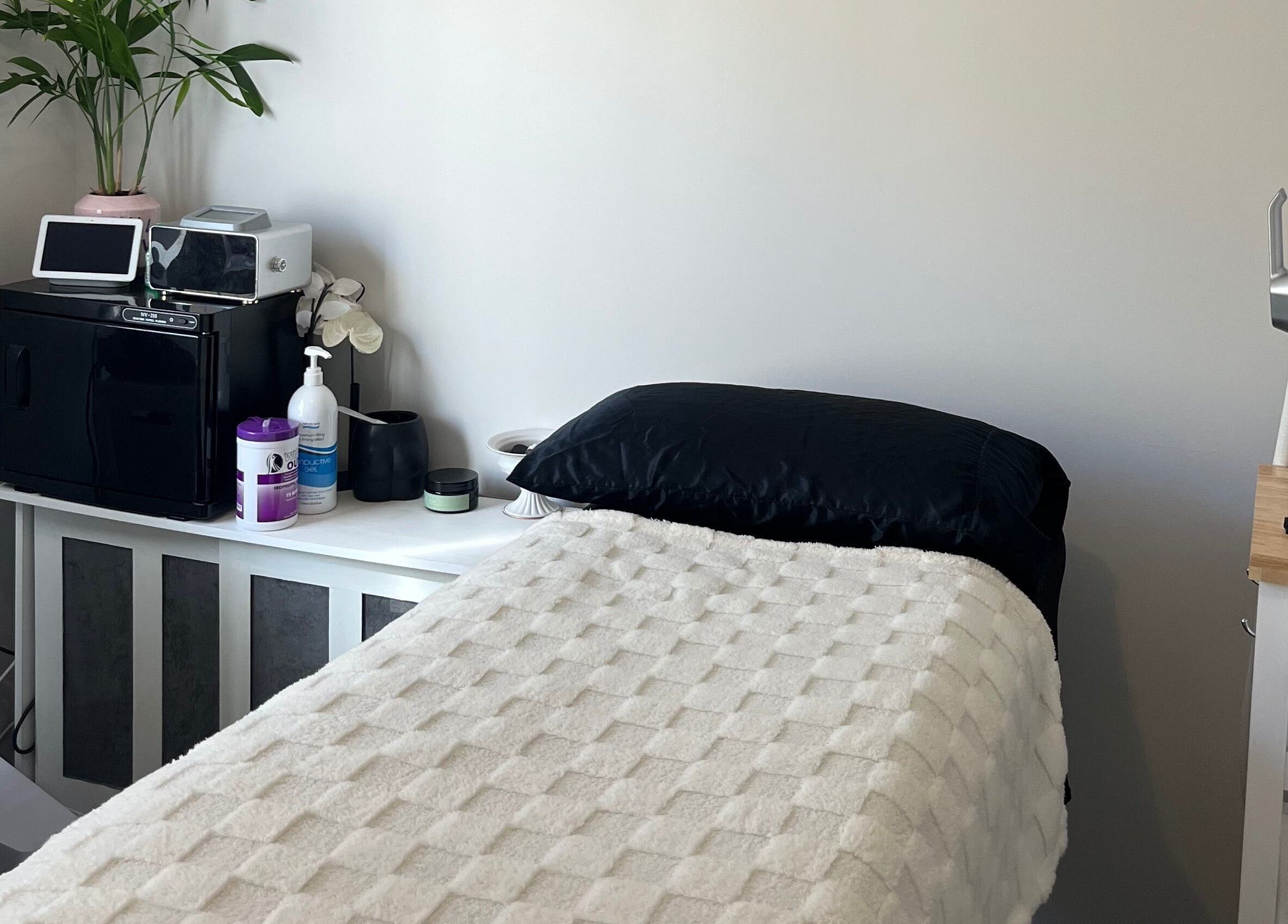 Relaxing treatment room at Gods Work Studio, Hilbert, Western Australia, AU with a cozy bed setup.