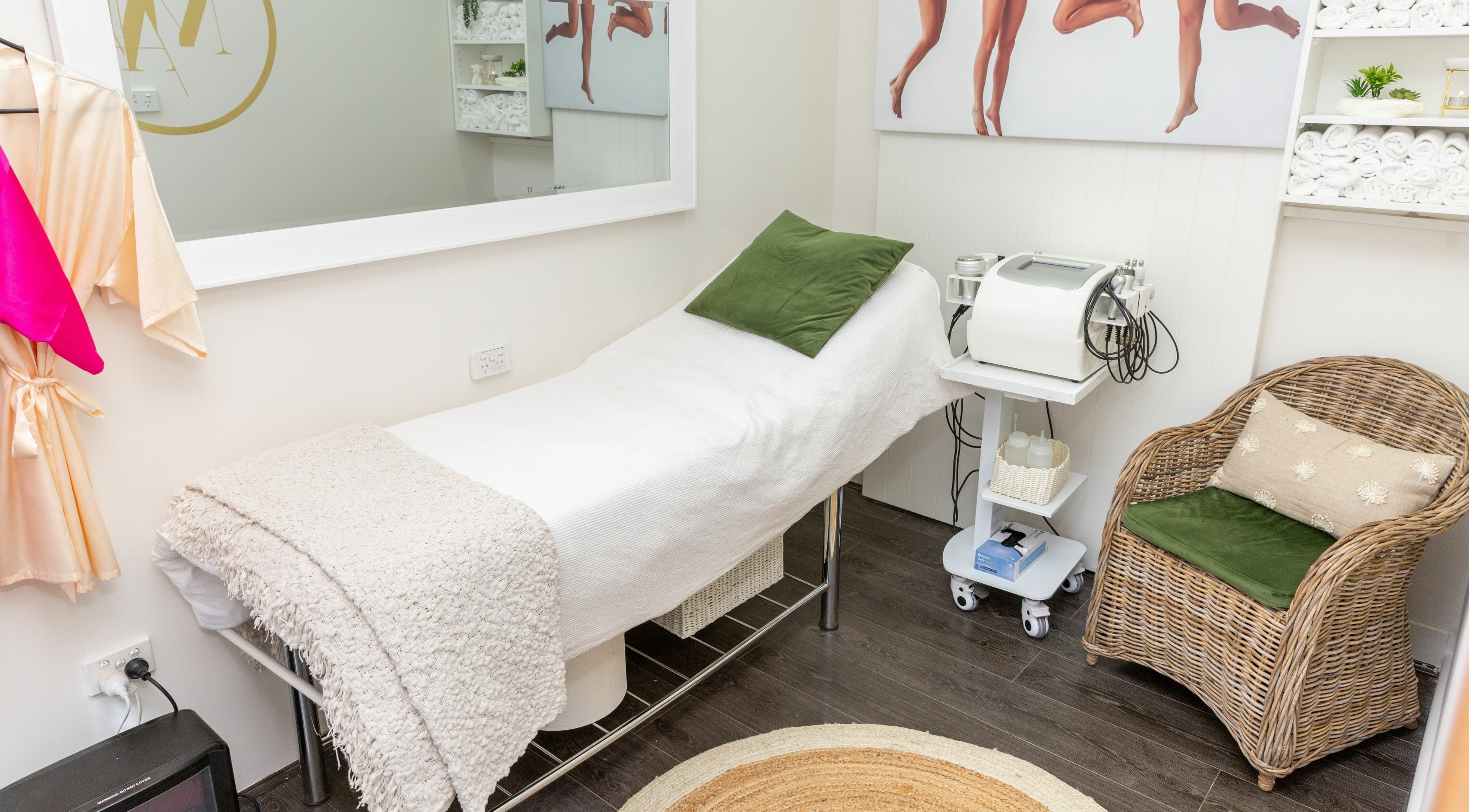 Relaxing treatment room at MA Beauty, Melbourne, Victoria, AU featuring a cozy bed and chic decor.