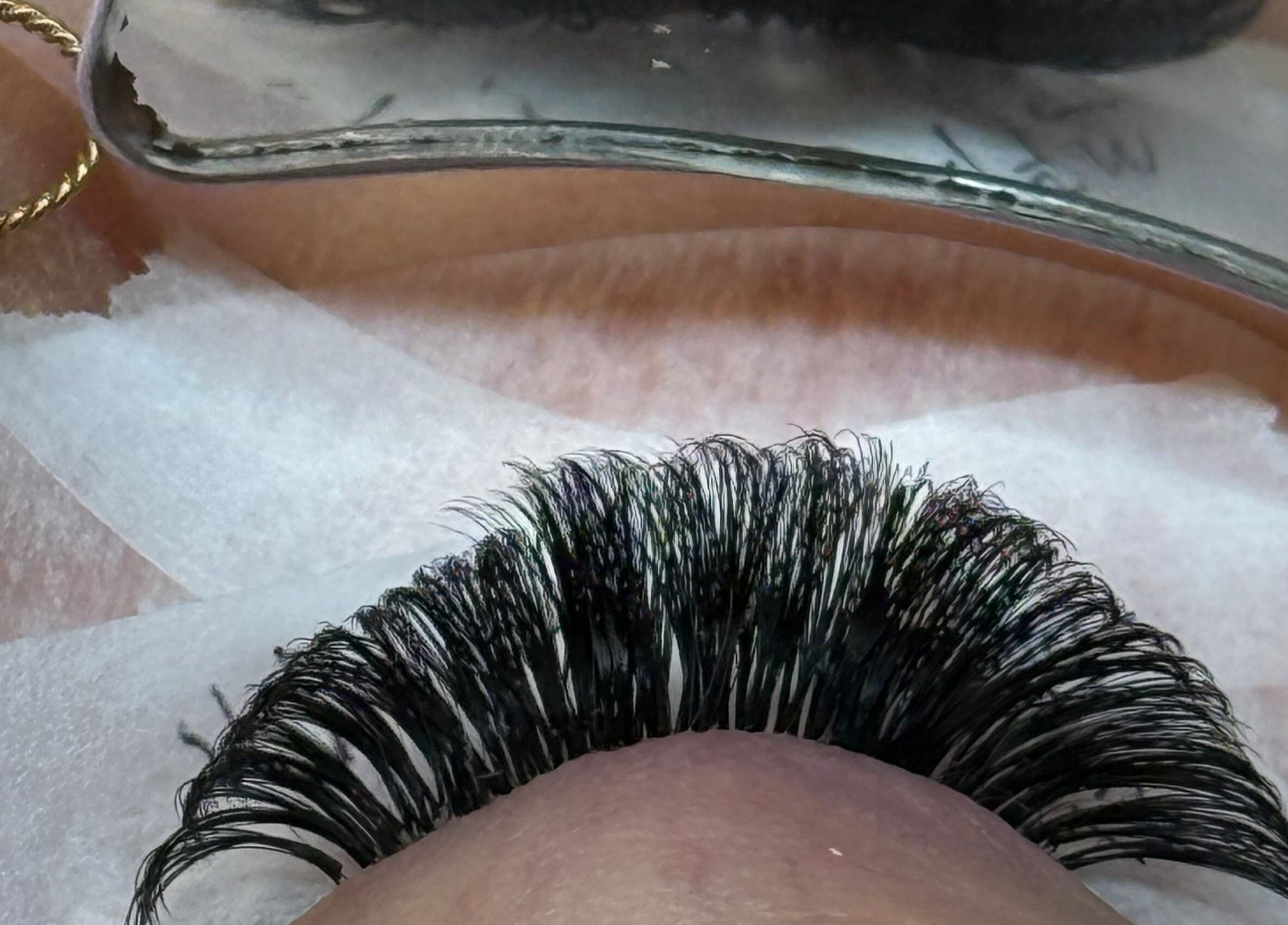 Eyelash extensions application at Belles Beauty, Mirfield, England, GB, showcasing precision and expertise.