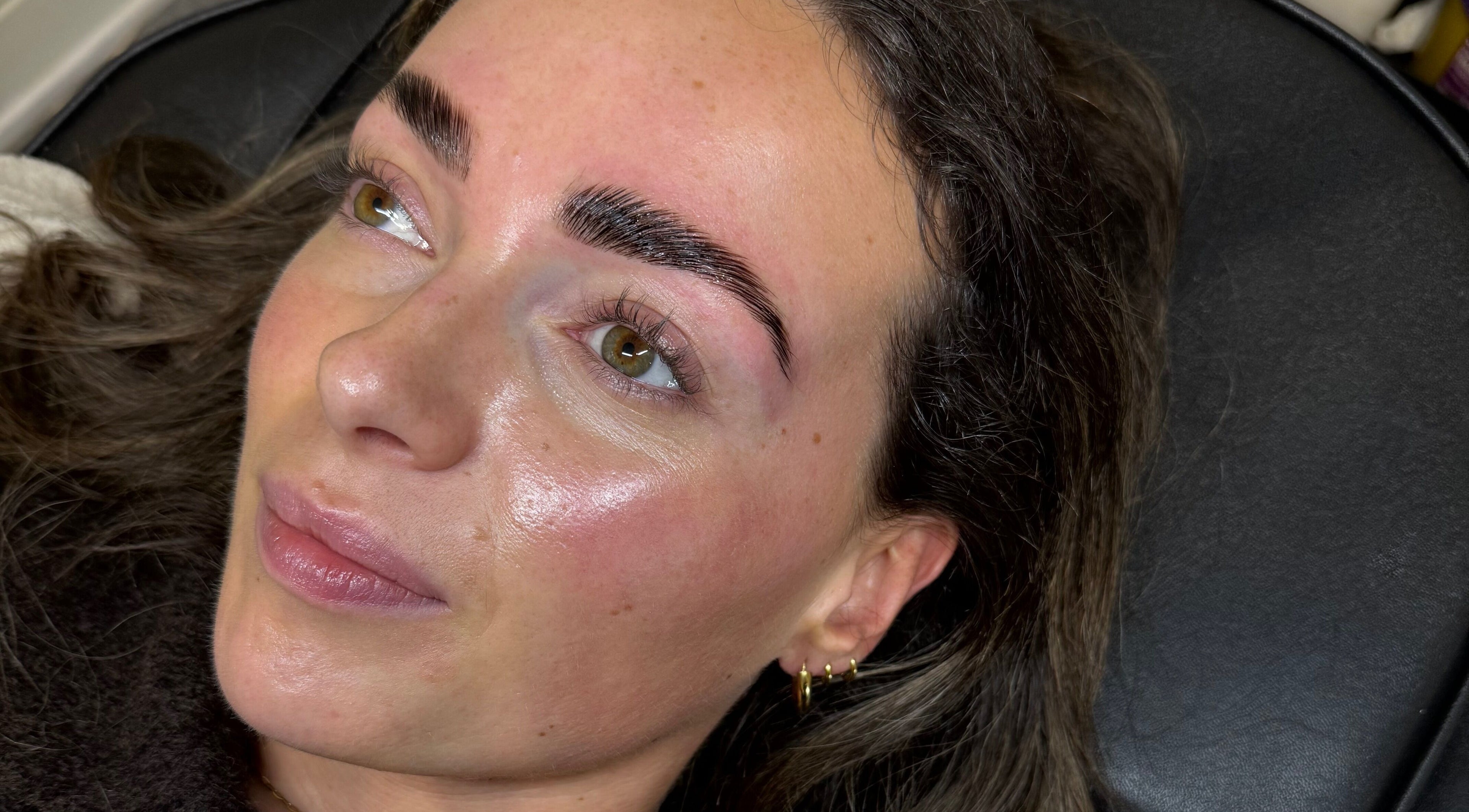 A client showcases expertly shaped brows from FACES Brows Lashes Makeup, Ilkley, England, GB.