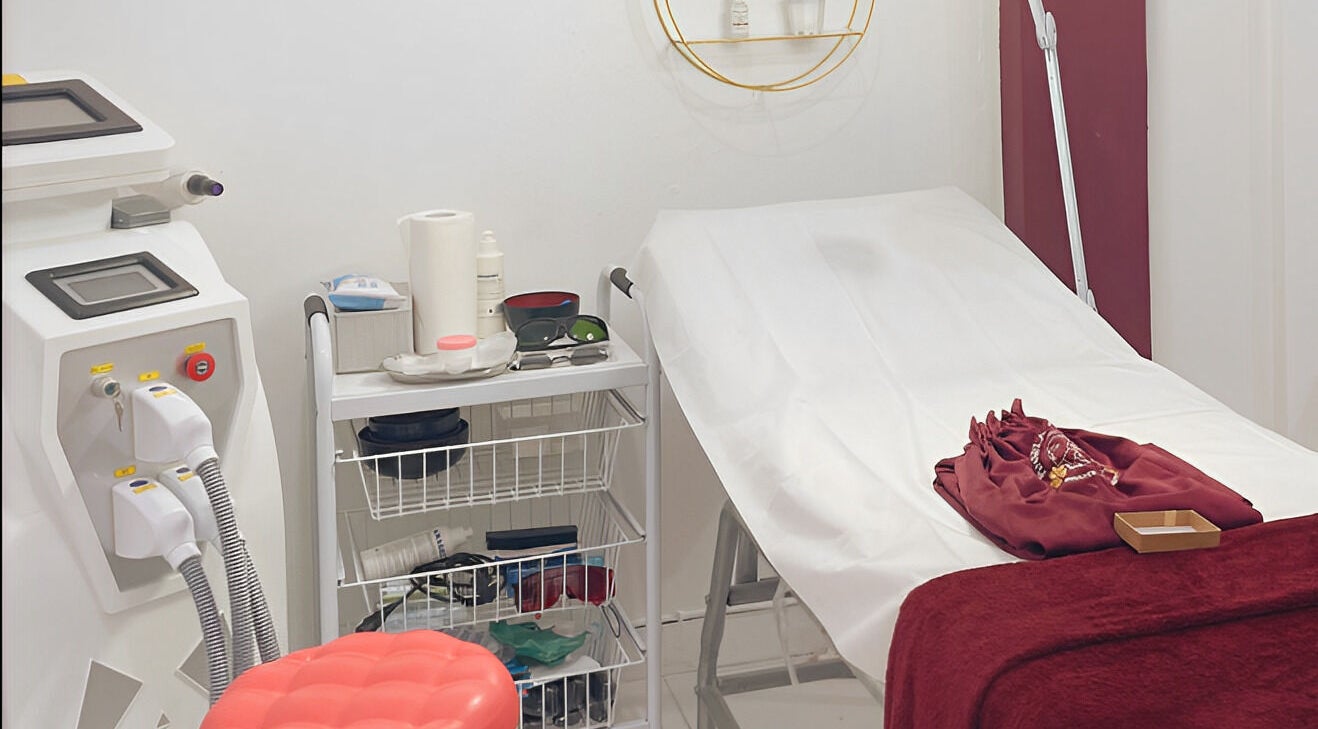 Treatment room at Pinsela Aesthetic in Bali, Bali, ID, featuring a clean bed and advanced skincare equipment.