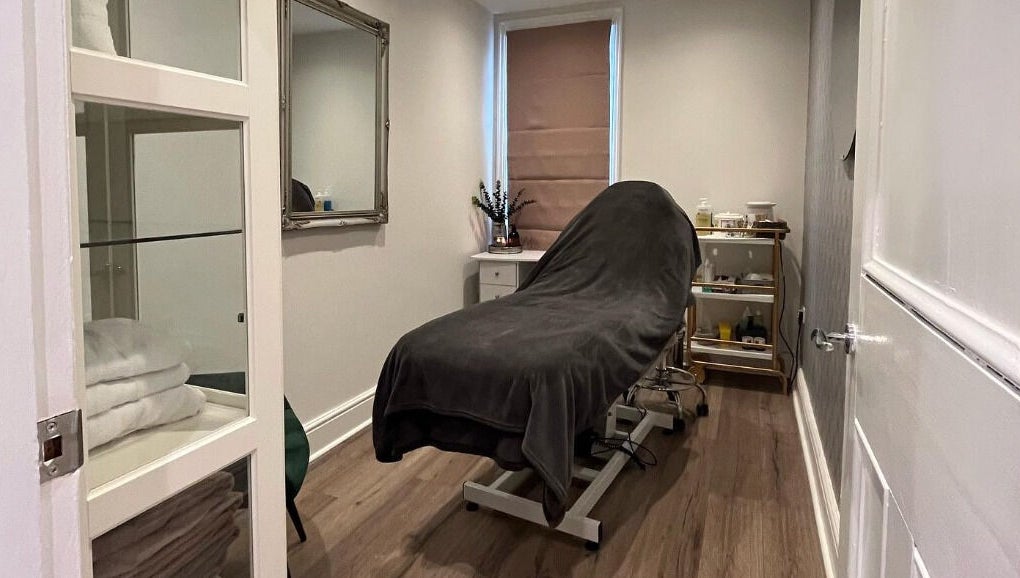 Cozy treatment room at Prettyme Hair and Beauty in Derby, England, GB, featuring a massage bed and modern decor.