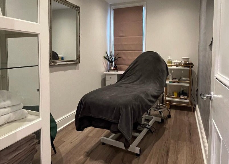 Cozy treatment room at Prettyme Hair and Beauty in Derby, England, GB, featuring a massage bed and modern decor.