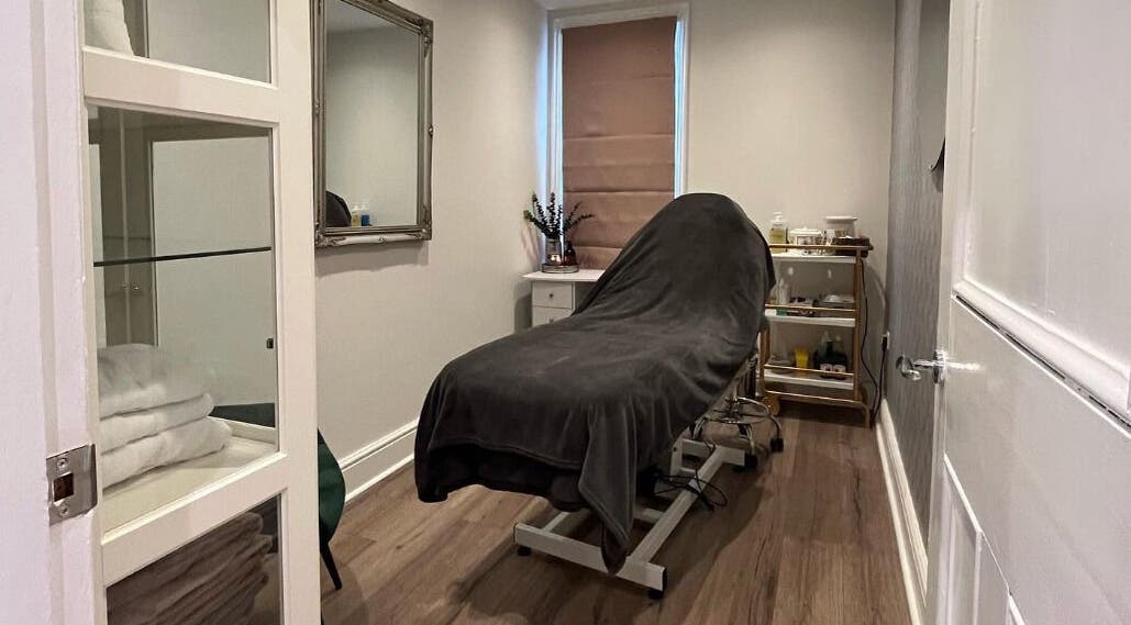 Cozy treatment room at Prettyme Hair and Beauty in Derby, England, GB, featuring a massage bed and modern decor.