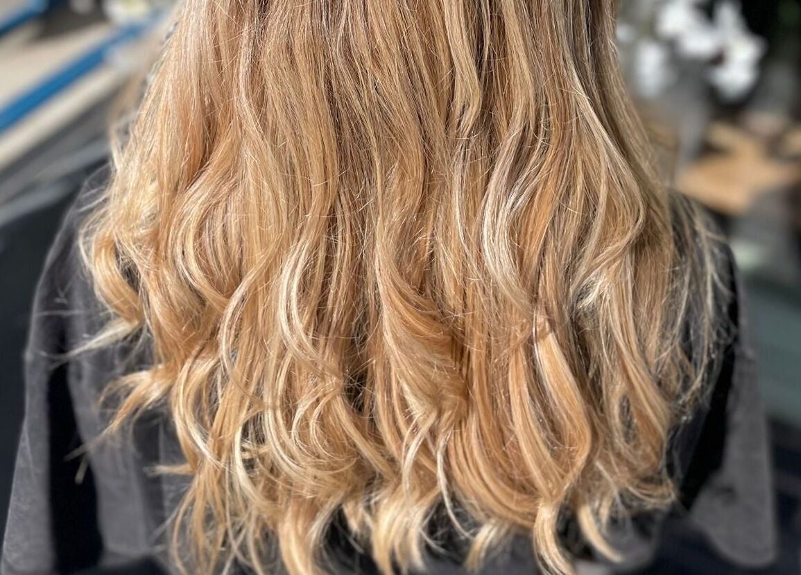 Stylish wavy blonde hair treatment at Prettyme Hair and Beauty, Derby, England, GB.