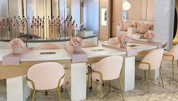 Elegant nail salon interior at Nail'd It Birmingham, Birmingham, England, GB featuring plush chairs and chic decor.