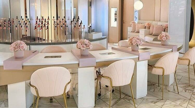 Elegant nail salon interior at Nail'd It Birmingham, Birmingham, England, GB featuring plush chairs and chic decor.