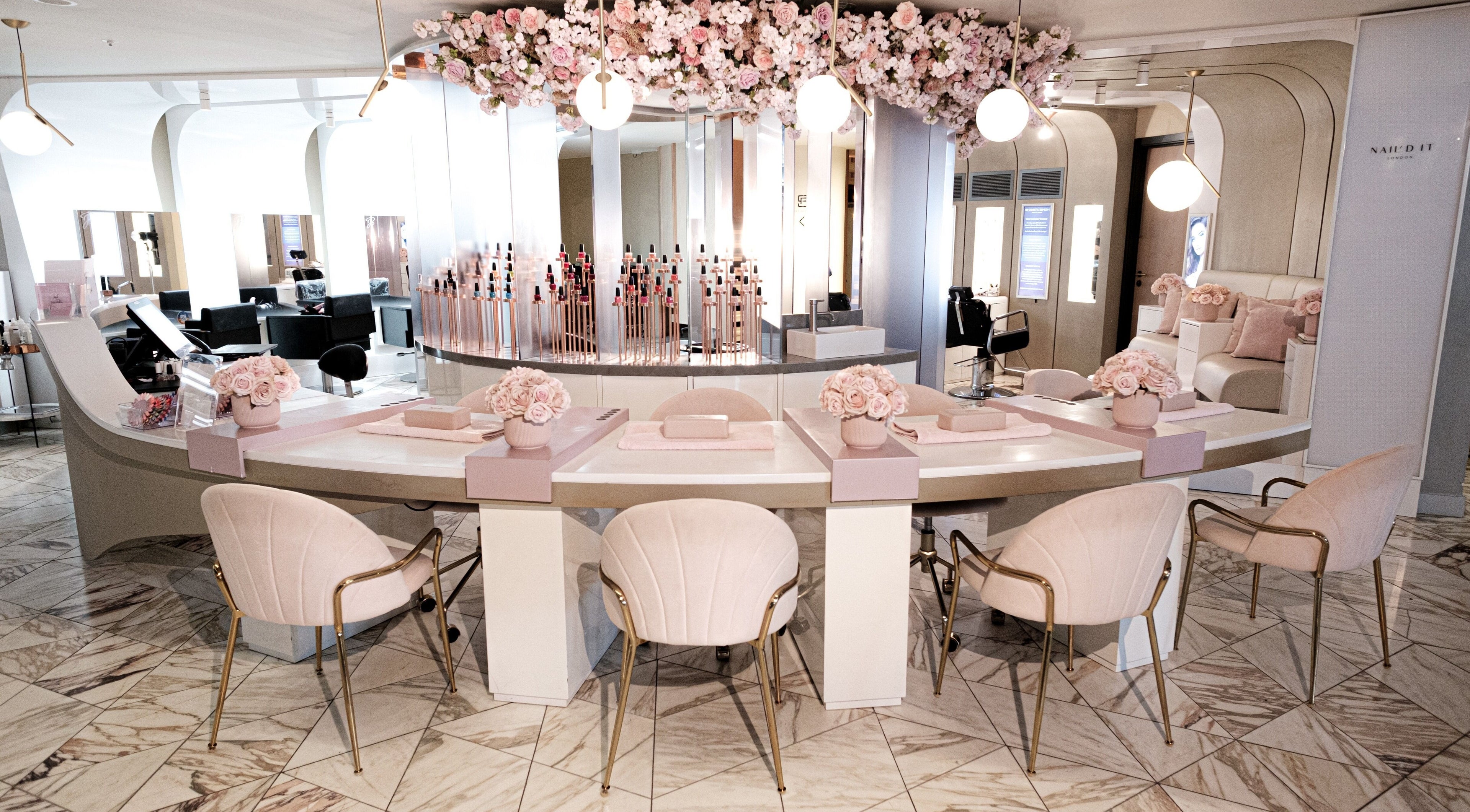 Chic interior of Nail'd It Birmingham with floral decor in Birmingham, England, GB.