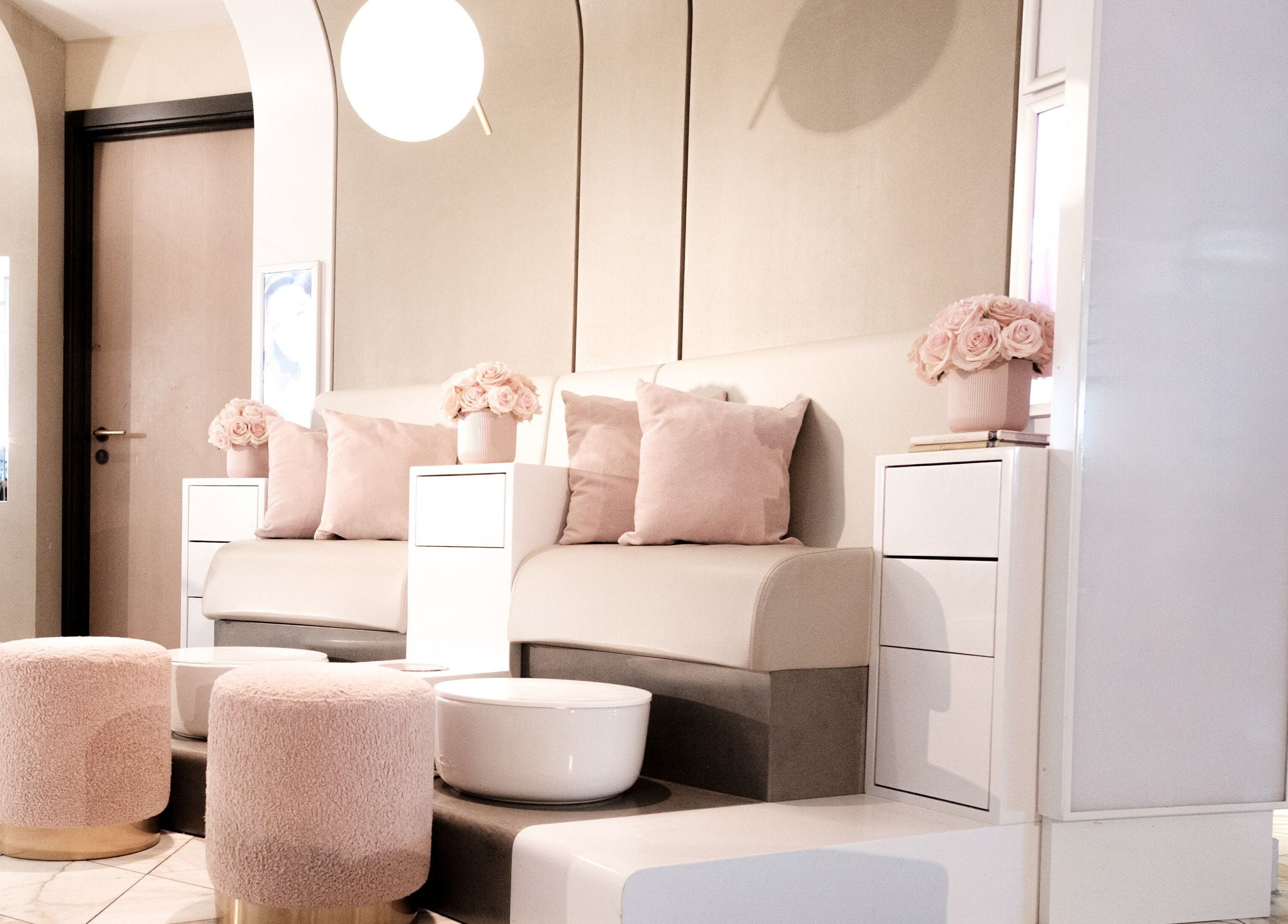 Elegant seating area at Nail'd It Birmingham, Birmingham, England, GB showcasing luxury decor.
