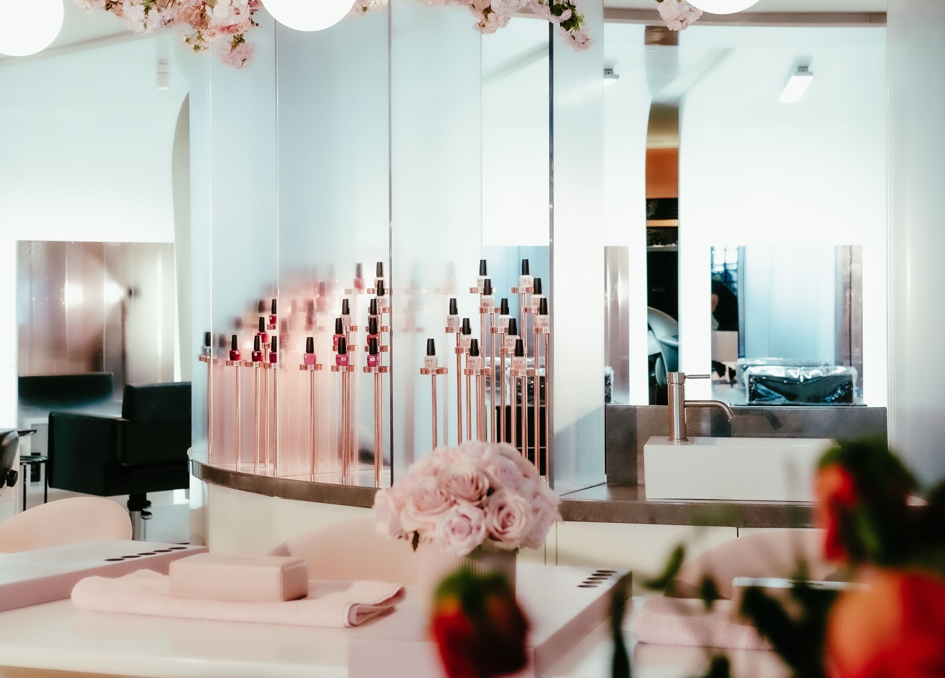 Chic interior of Nail'd It Birmingham showcasing stylish nail polish display, in Birmingham, England, GB.