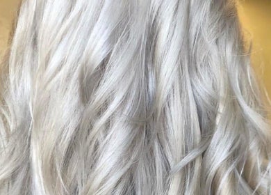 Silvery blonde hair styled at Hair By Lorna Oldroyd, Ossett, England, GB, showcasing a sleek, modern look.