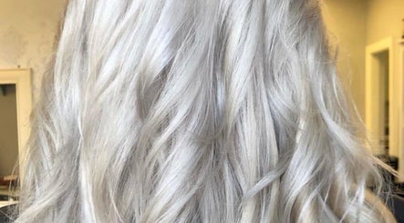 Silvery blonde hair styled at Hair By Lorna Oldroyd, Ossett, England, GB, showcasing a sleek, modern look.