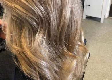 Blonde hair styled at Hair By Lorna Oldroyd, Ossett, England, GB. Stunning waves and vibrant color.