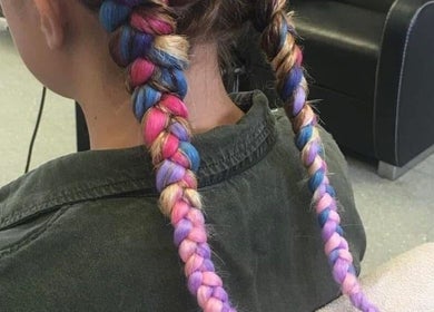 Colorful braided hairstyle at Hair By Lorna Oldroyd in Ossett, England, GB.