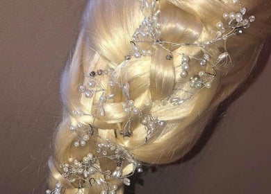 Intricate braided hairstyle with pearls at Hair By Lorna Oldroyd, Ossett, England, GB.