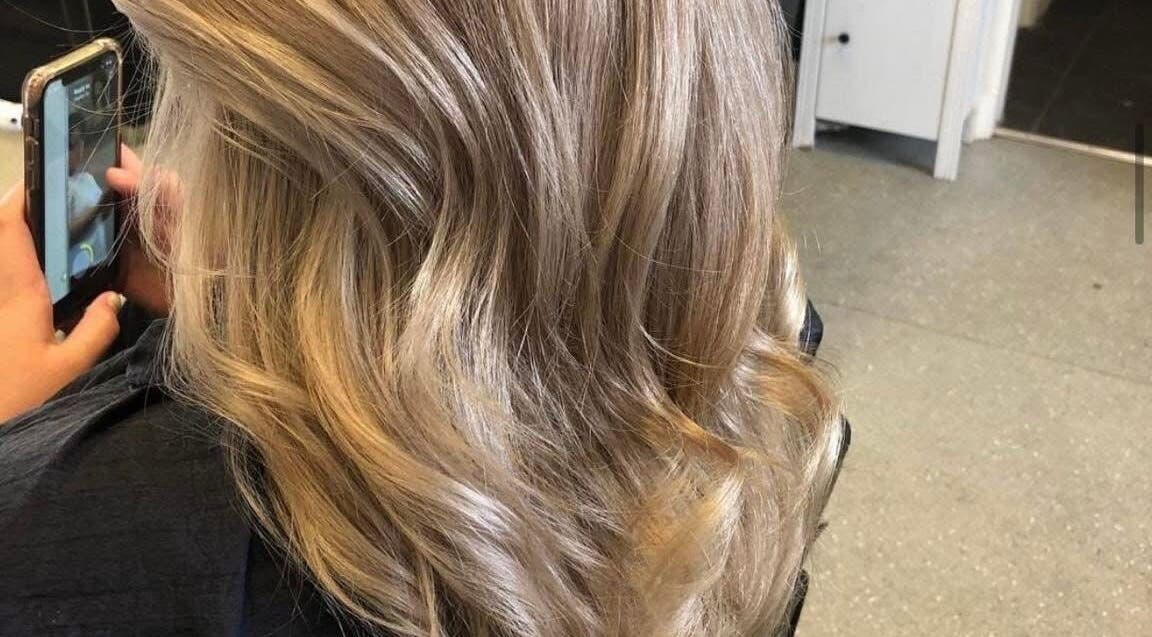 Blonde wavy hairstyle at Hair By Lorna Oldroyd, Ossett, England, GB showcasing modern hair trends.