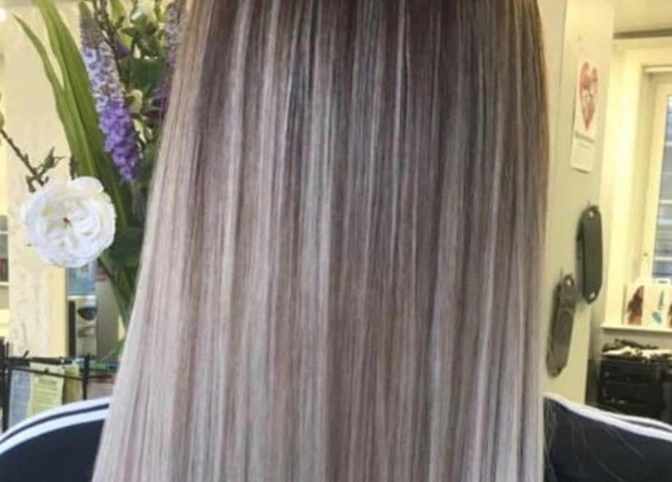 Long, straight hair with highlights at Hair By Lorna Oldroyd in Ossett, England, GB.
