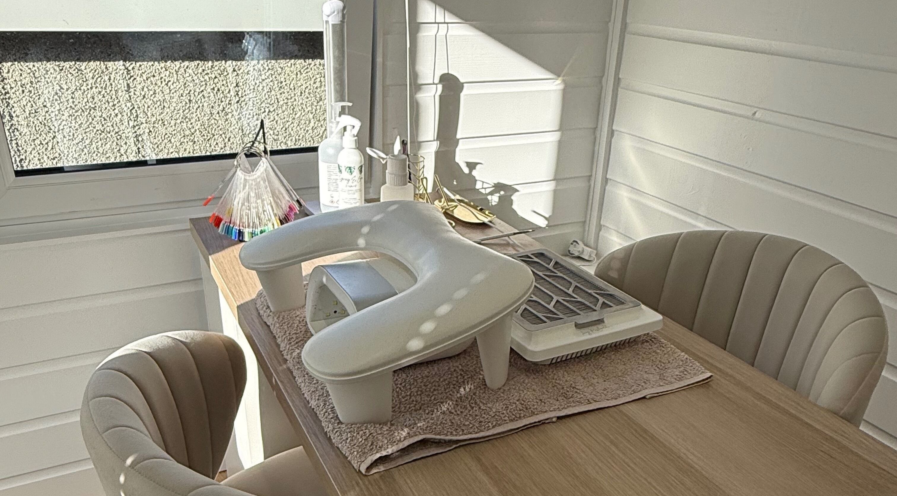 Cozy nail station at Nails by Rachel, Aberdeen, Scotland, GB featuring manicure tools and comfortable seating.
