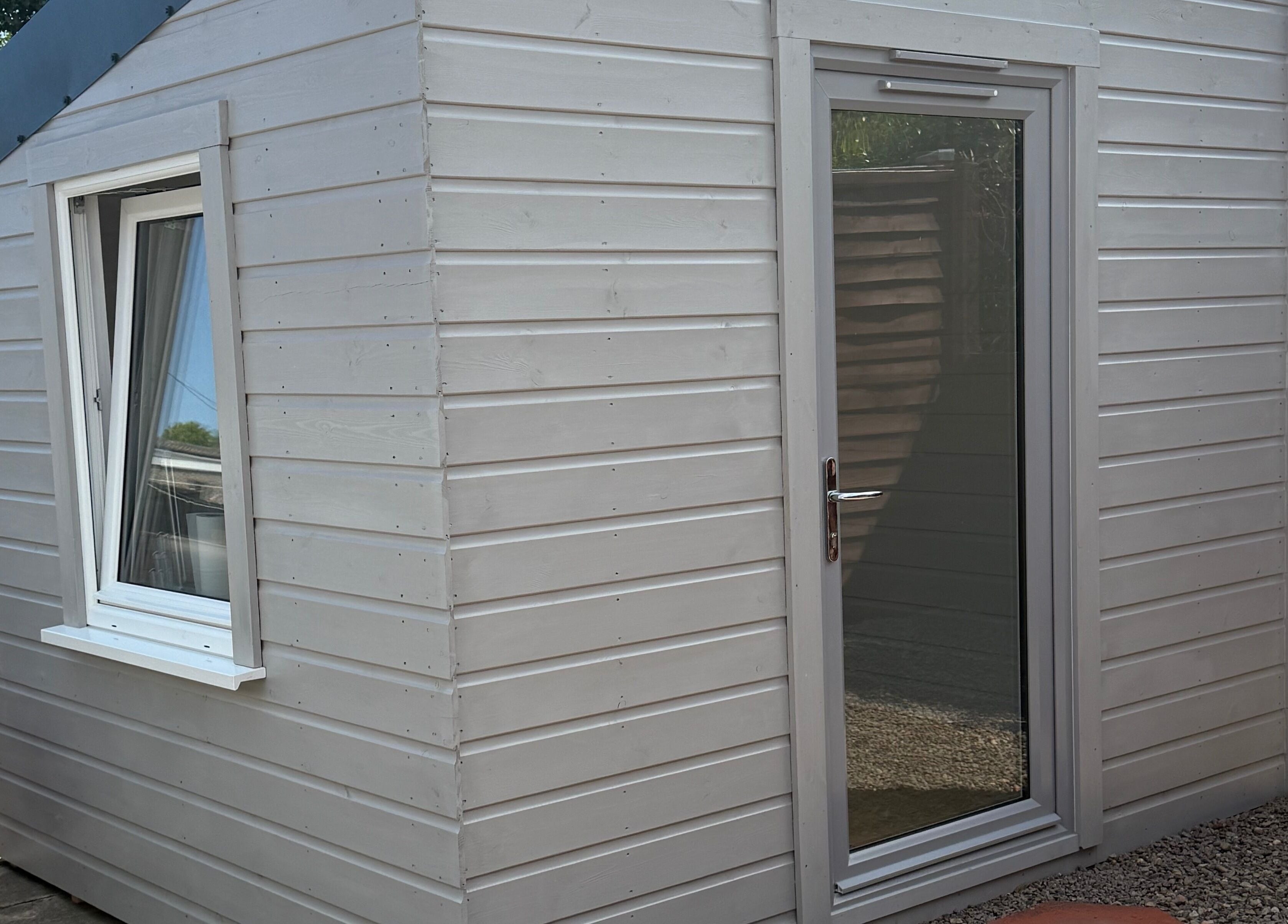 Exterior of Nails by Rachel in Aberdeen, Scotland, GB showcasing a chic wooden cabin.