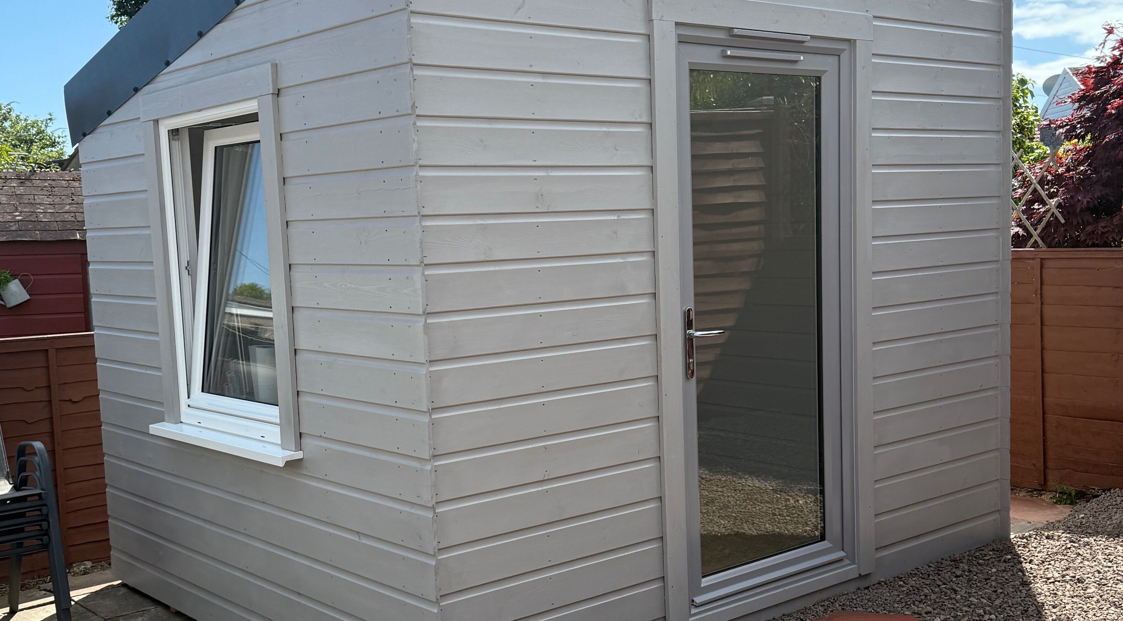 Exterior of Nails by Rachel in Aberdeen, Scotland, GB showcasing a chic wooden cabin.