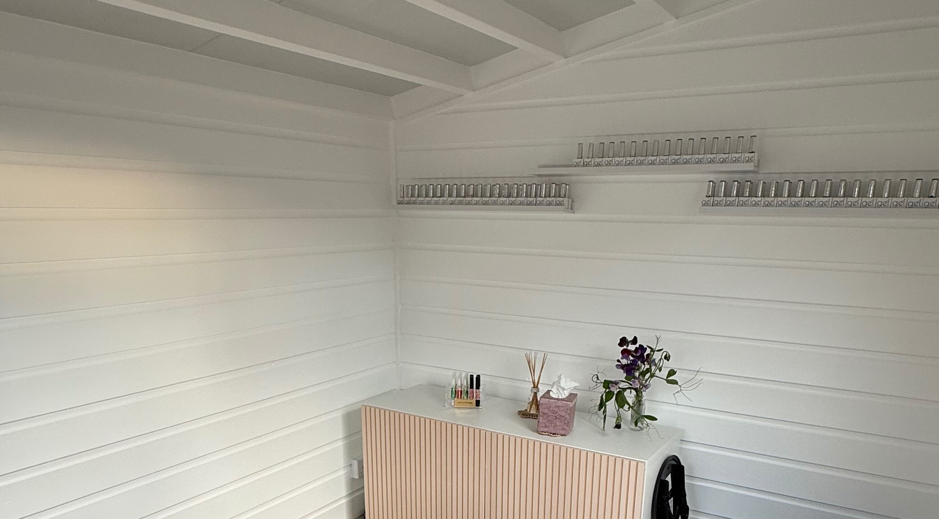 Elegant nail studio corner at Nails by Rachel, Aberdeen, Scotland, GB showcasing organized polish display.