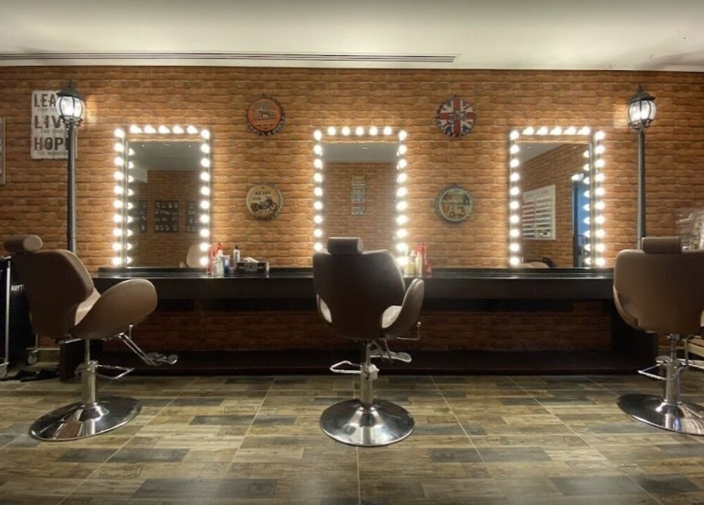Elegant salon chairs and mirrors at Glam Street DMCC, Dubai, AE, showcasing a stylish beauty space.