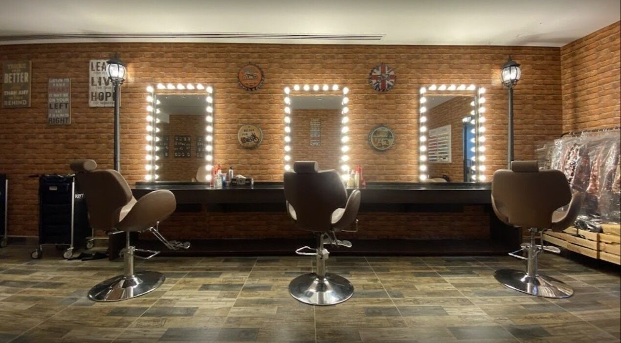 Elegant salon chairs and mirrors at Glam Street DMCC, Dubai, AE, showcasing a stylish beauty space.