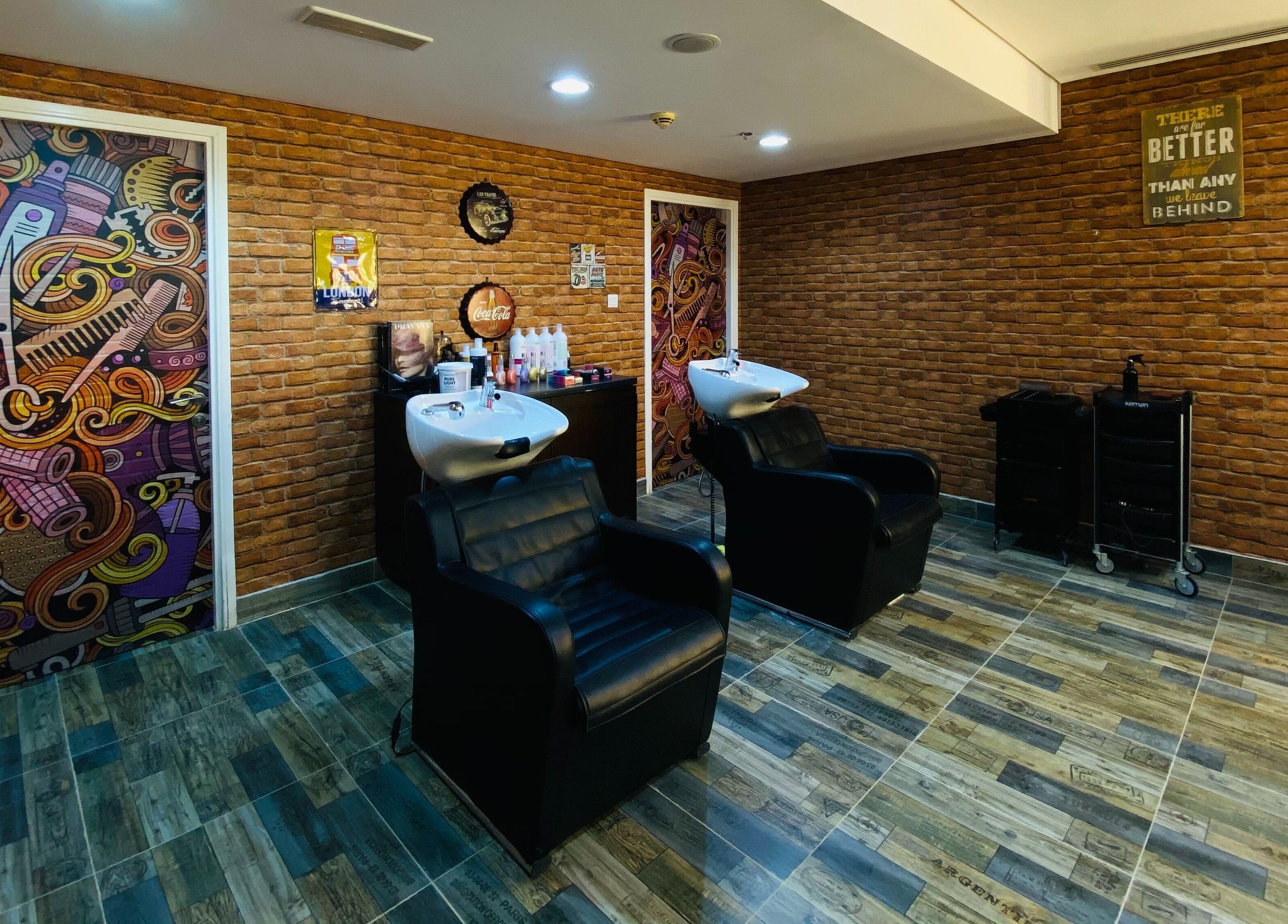 Modern salon wash area at Glam Street DMCC in Dubai, AE with chic decor and comfortable chairs.